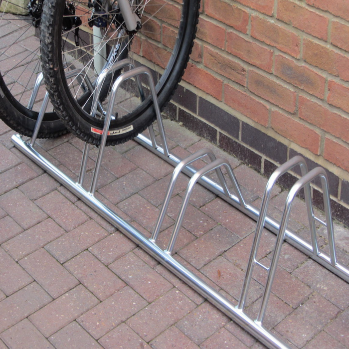 bison products 4 bike dual height bike rack for bikes with disc breaks, floor mounted wall mounted zinc coated silver with fixings.