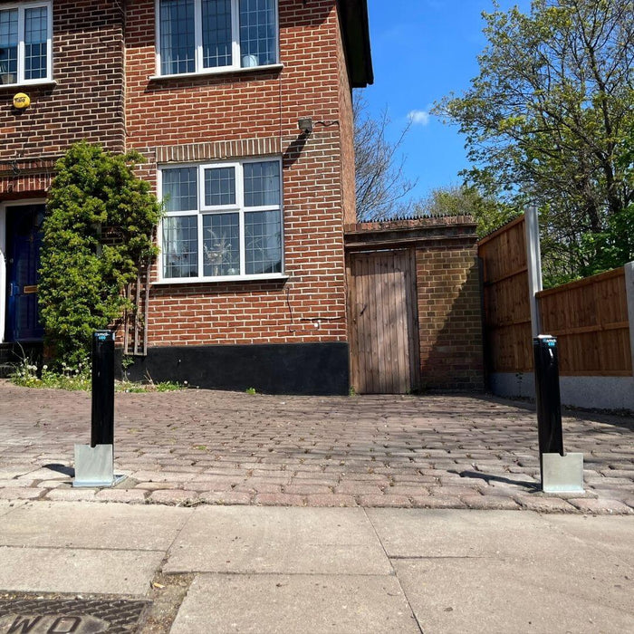 Bison Products Ramco 600 telescopic car security bollard powder coated and 600mm high installed in printed concrete driveway