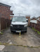 Ramco 100 telescopic security bollard with hi-vis tape installed on driveway protecting a Mercedes Sprinter Vanmaster campervan