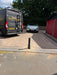 Ramco 600 telescopic security bollard professionally installed on block-paved driveway by Bison Products — close-up view