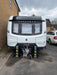 Two Ramco 100 telescopic security bollards installed either side of a Coachman Xcel caravan on a residential driveway for theft deterrence