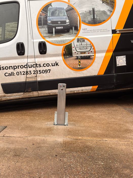 Security bollard installed in concrete driveway to protect a motorhome. 