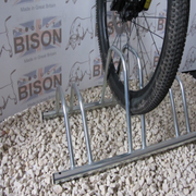 3 bike dual height flat top for bikes with disc brakes for easy storage and access. floor or wall mounted. Shown with bike.