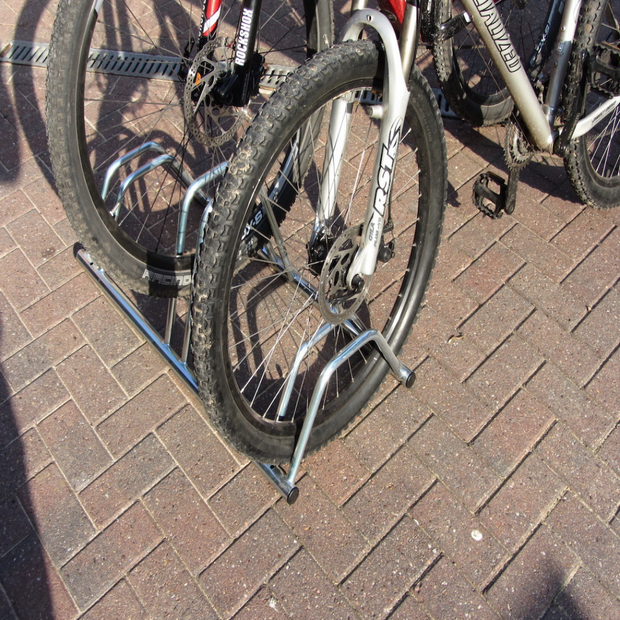 3 bike dual height flat top for bikes with disc brakes for easy storage and access. floor or wall mounted.  Shown with 3 bikes.