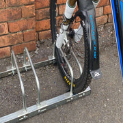 Adjustable bike rack for 3 bikes with tyre widths ranging from 15mm to 100mm showing large tyre wheel
