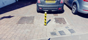 Ramco 600 Square Telescopic Driveway Security Post yellow installed.